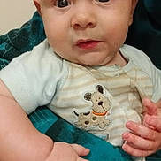 Donald joined the competition — help win amazing prizes! baby, infant, child, closeup, face, hands, clothing, striped, cute, indoor, person, expression, holding, blanket, patch, cartoon, cute_outfit, skin, portrait, young