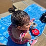 Mariella is registered to the contest to win money with this photo: blue_towel, child, earrings, girl, hair, outdoor, pink, playtime, relaxing, ruffles, sippy_cup, sitting, skin, summer, sunny_day, swimsuit, top_knot, towel, toy, water