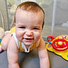 Kaden is registered to the contest to win money with this photo: arm, baby, child, colorful, crawling, cute, expression, face, fun, happy, head, indoor, infant, person, play, playpen, skin, smile, toy, young