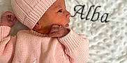 Alba a rejoint le concours — aidez-le/la à gagner de superbes lots ! baby, blanket, buttoned_sweater, child, cozy, cute, embroidered_name, indoors, infant, knit_hat, knit_sweater, newborn, peaceful, pink_clothing, portrait, profile_view, sleeping, soft_texture, tiny_hand, white_blanket