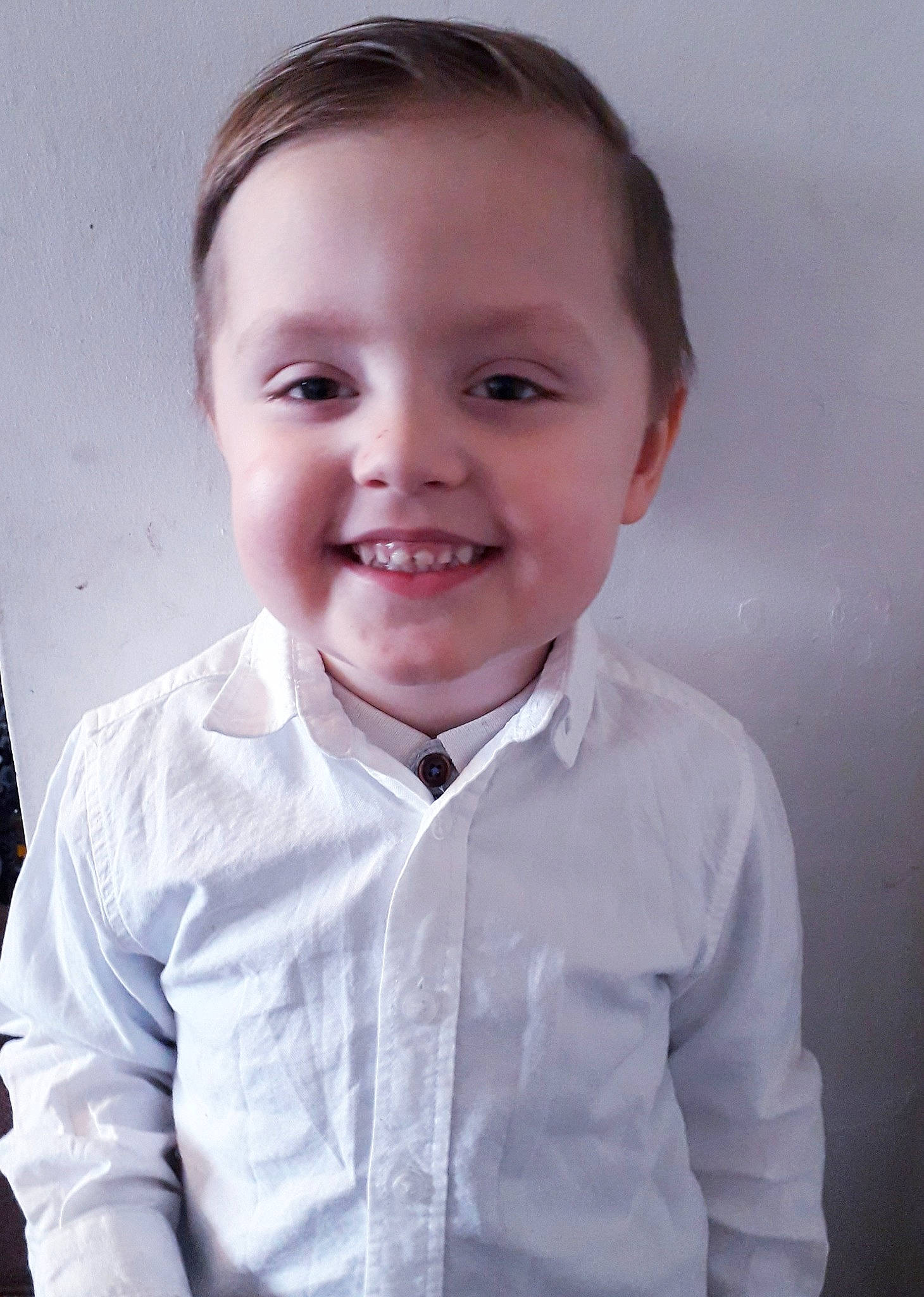 Robert is registered to the contest to win money with this photo: arm, baby_toddler_clothing, cheek, collar, dress_shirt, eyebrow, flash_photography, formal_wear, gesture, happy, iris, jaw, joy, lip, nose, outerwear, person, shoulder, sleeve, smile