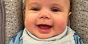 Johnathan Wyatt is registered to the contest to win money with this photo: baby, babylaughing, bodypart, clothing, coat, cushion, face, furniture, happy, hat, head, homedecor, jacket, laughing, mouth, person, photography, portrait, smile, teeth