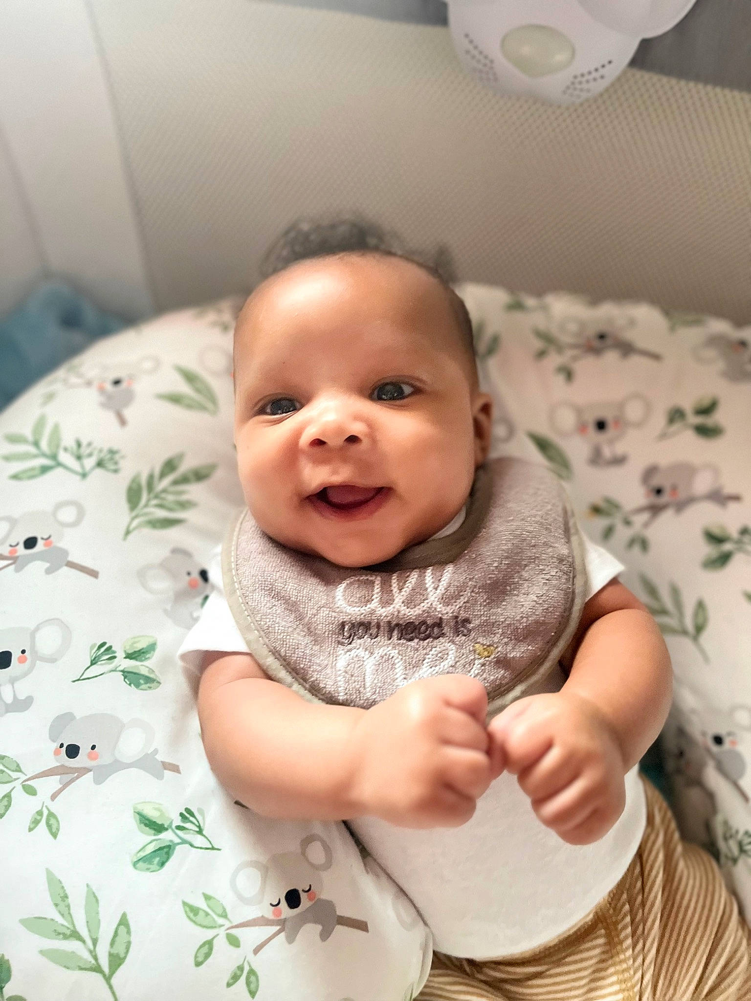 Major is registered to the contest to win money with this photo: arm, baby, baby_toddler_clothing, cheek, child, comfort, eye, face, happy, head, linens, mechanical_fan, pattern, person, product, skin, sleeve, smile, t_shirt, toddler