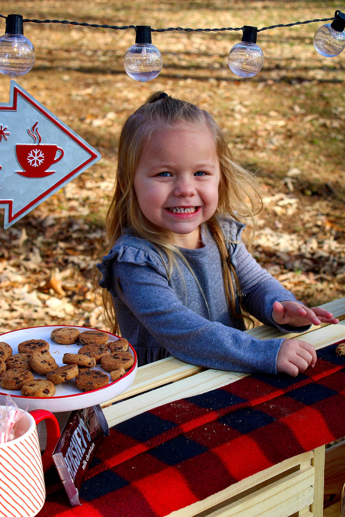 Mylie is registered to the contest to win money with this photo: child, city, cuisine, fun, grass, happy, ingredient, joy, leisure, pattern, people_in_nature, person, plaid, play, portrait_photography, recreation, sitting, smile, soil, tartan