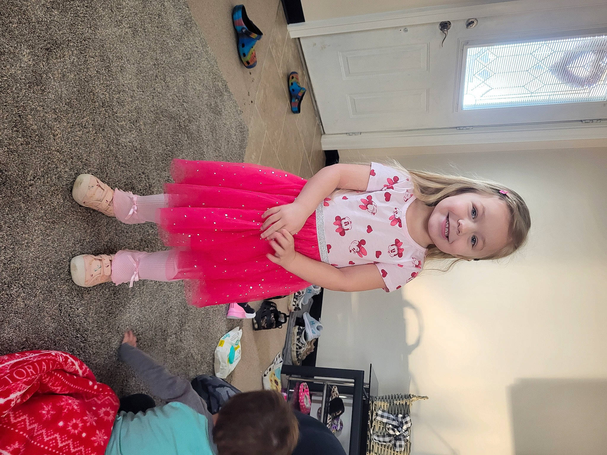 Mylie joined the competition — help win amazing prizes! baby_toddler_clothing, child, dress, flooring, foot, fun, happy, hat, human_leg, joy, magenta, pattern, person, pink, room, sandal, smile, sock, thigh, toddler