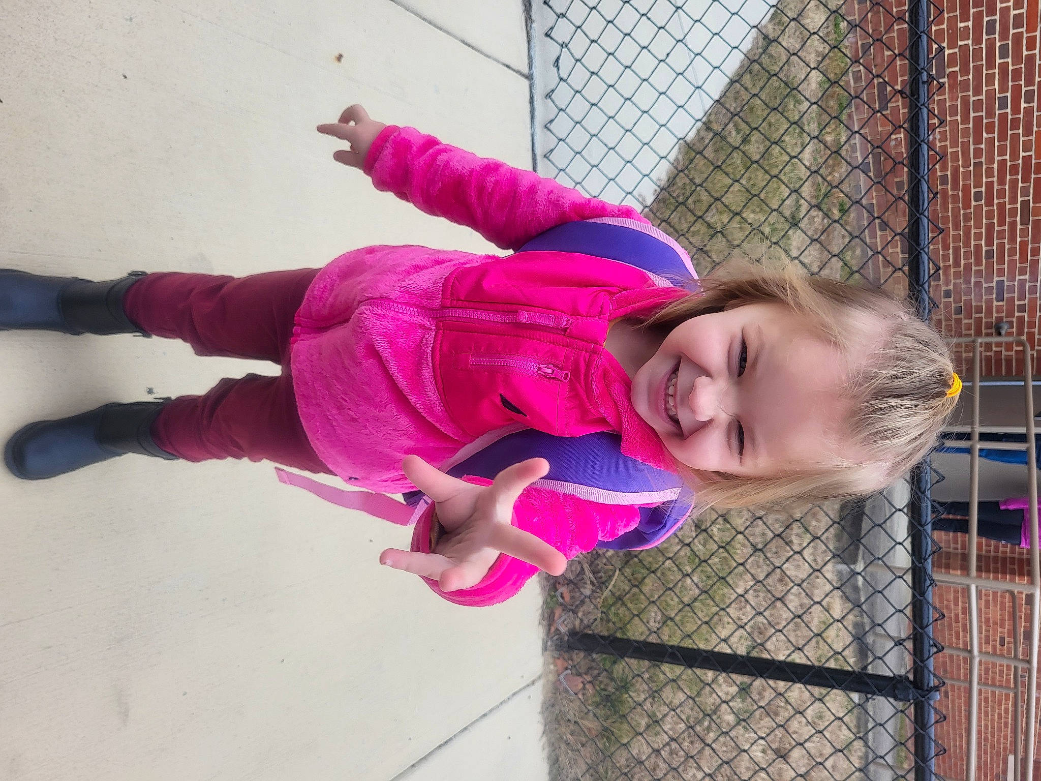 Mylie joined the competition — help win amazing prizes! baby_toddler_clothing, child, fence, fun, happy, joy, leisure, magenta, mesh, pattern, person, pink, plant, play, purple, recreation, smile, toddler, tree, wire_fencing