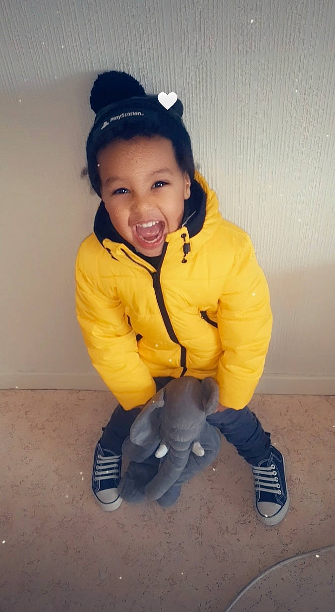 Amir participe au concours pour gagner de l'argent avec cette photo : baby_toddler_clothing, black_hair, cap, cheek, cool, electric_blue, flash_photography, fun, gesture, happy, human_body, nose, outerwear, person, personal_protective_equipment, shoe, sleeve, smile, sneakers, standing