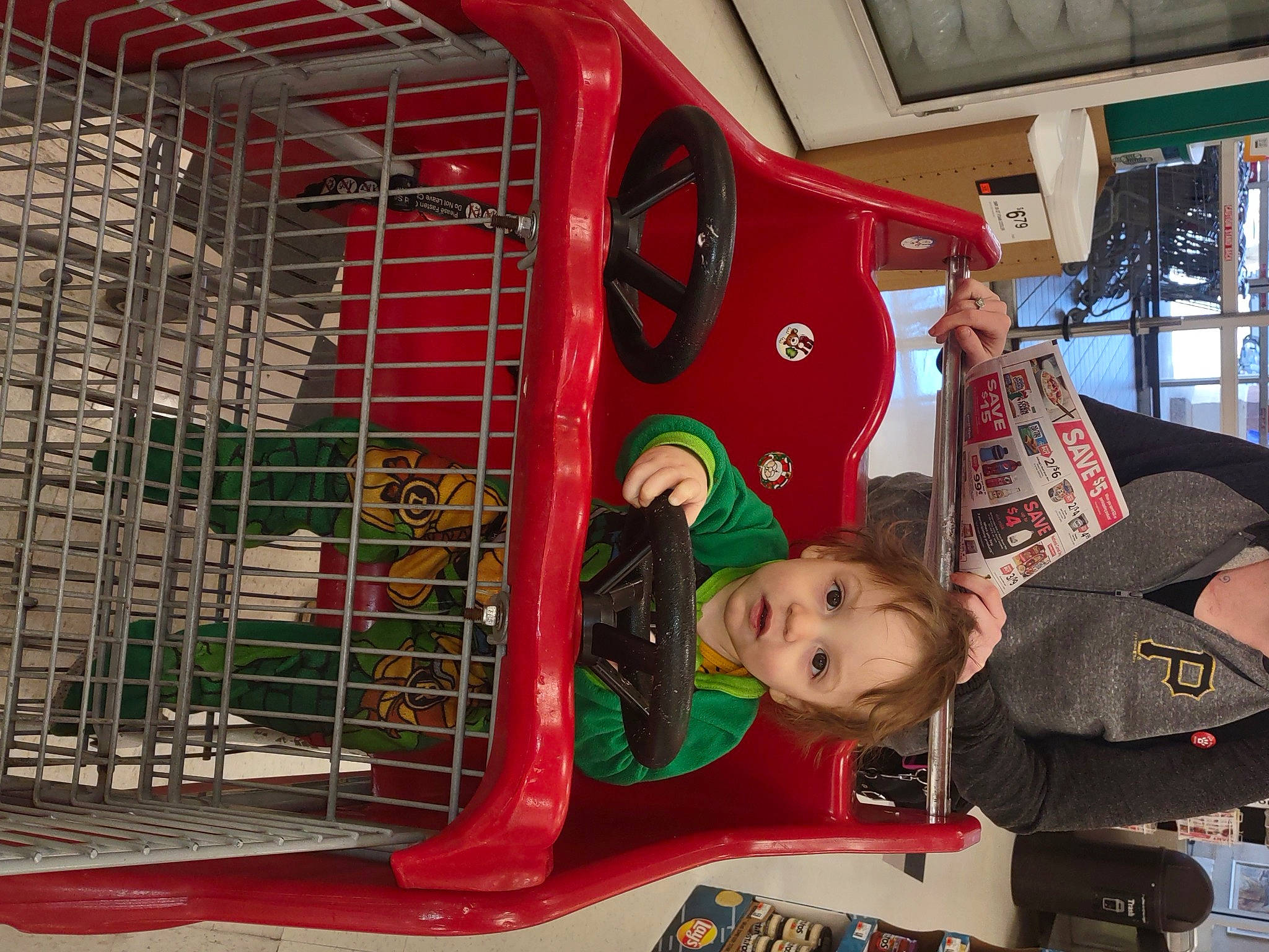 Miguel joined the competition — help win amazing prizes! automotive_exterior, automotive_lighting, baby, child, engineering, fun, machine, mammal, motor_vehicle, person, pet_supply, photograph, product, red, service, shopping_cart, snapshot, tire, toddler, vehicle