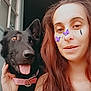 woman, dog, black_dog, selfie, indoor, long_hair, pink_collar, digital_stickers, butterfly_stickers, tongue_out, pet, casual, tattoo, smiling, face, hand, window, hair, portrait, friendly