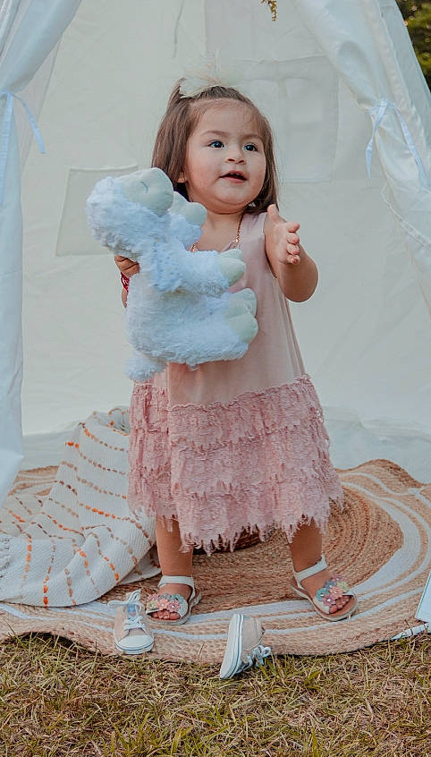 Maggie joined the competition — help win amazing prizes! baby, baby_toddler_clothing, day_dress, dress, embellishment, face, fashion_design, happy, one_piece_garment, pattern, person, pink, product, ruffle, shoe, skin, sleeve, smile, textile, toddler