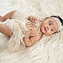 baby, infant, tutu, pearls, headband, fluffy_rug, soft_texture, cute, smiling, lying_down, portrait, child, adorable, accessories, fashion, happy, skin, hand, foot, young