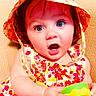 baby, child, hat, floral, dress, colorful, toy, green, yellow, surprised, blue_eyes, cute, infant, portrait, sitting, closeup, skin, face, expression, indoors