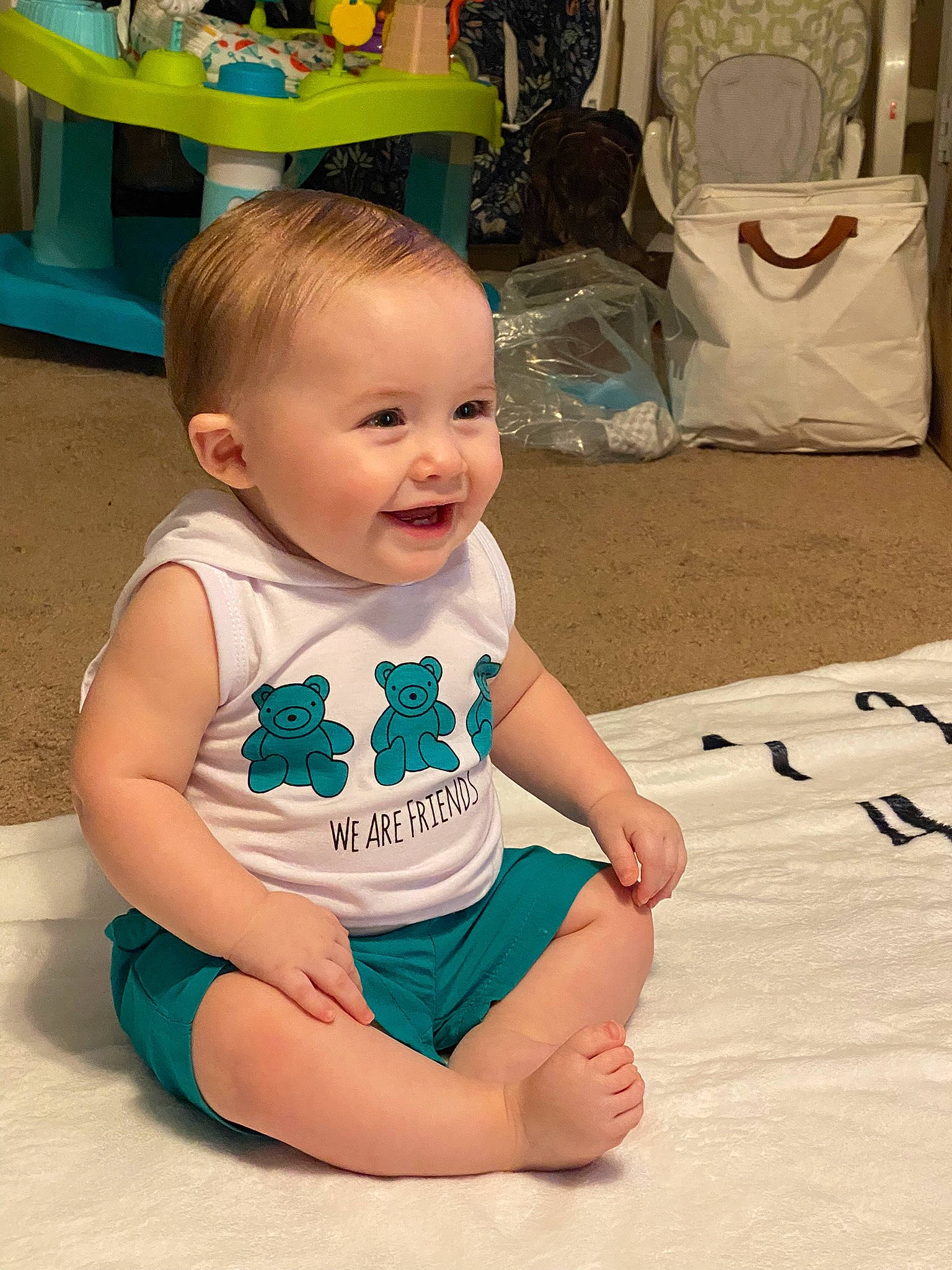 Levi joined the competition — help win amazing prizes! baby, baby_toddler_clothing, cheek, child, chin, floor, flooring, foot, fun, happy, human_leg, person, product, sitting, skin, sleeve, smile, t_shirt, thigh, toddler