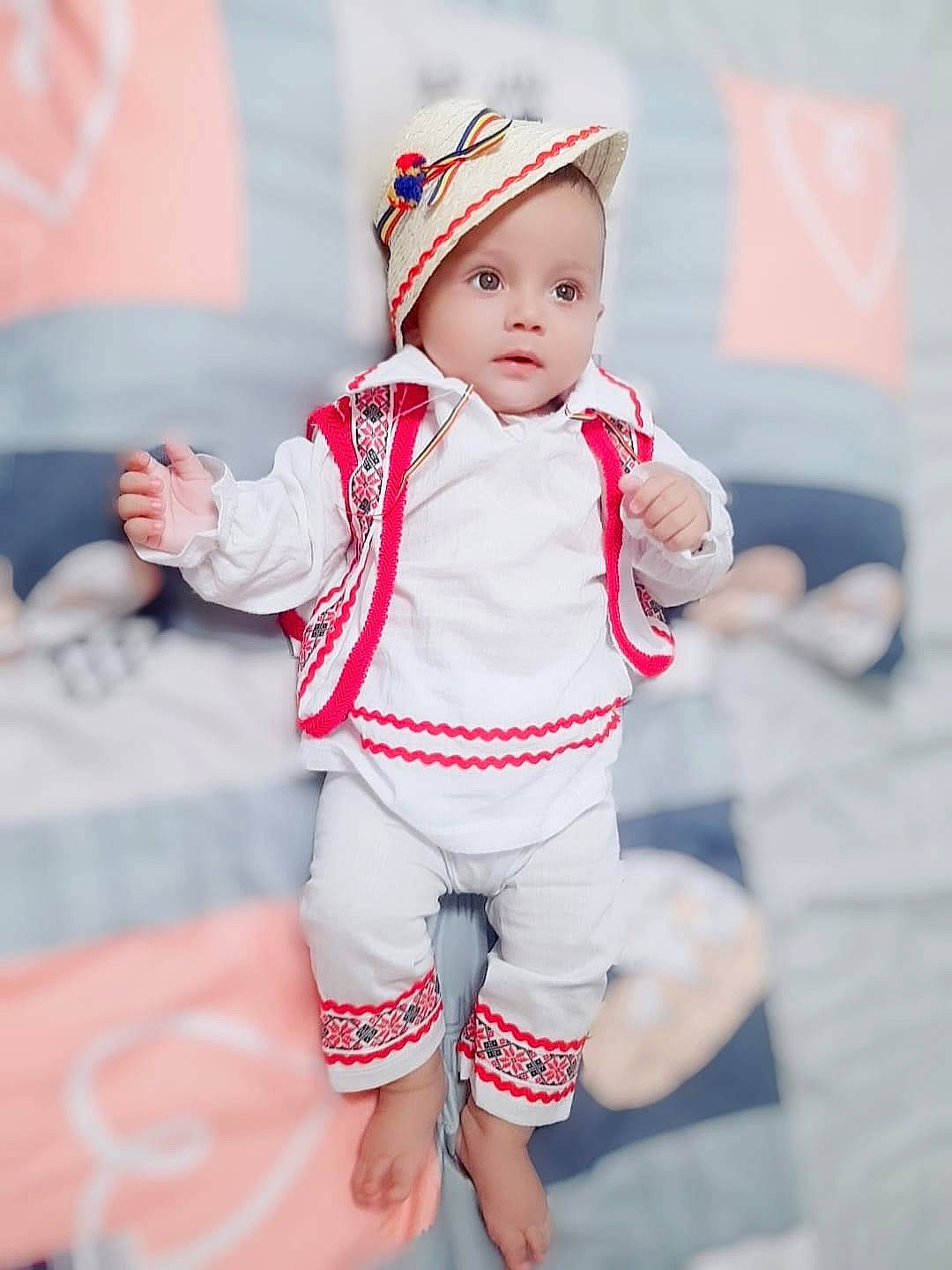 Leonte joined the competition — help win amazing prizes! baby, baby_toddler_clothing, cap, child, electric_blue, event, fashion_accessory, fun, gesture, happy, hat, human_body, pattern, person, pink, play, portrait_photography, sleeve, street_fashion, toddler