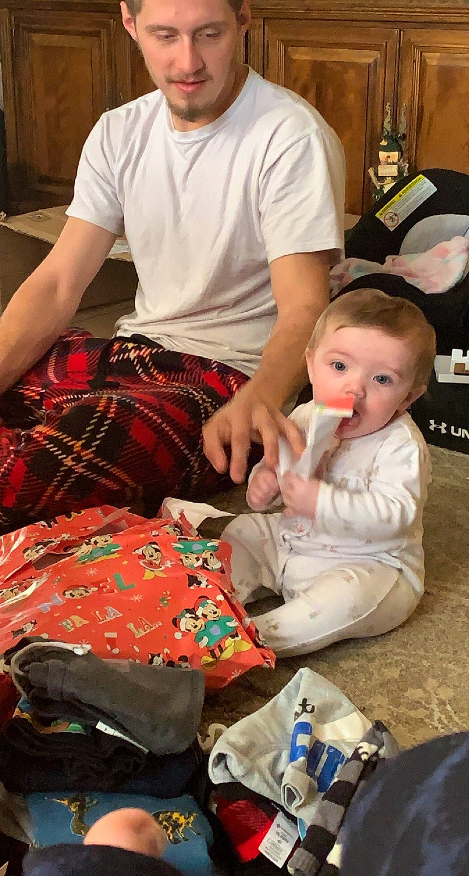 Starrlynn is registered to the contest to win money with this photo: baby, bag, child, comfort, event, fun, happy, headwear, holiday, lap, luggage_and_bags, pattern, person, plaid, room, sitting, t_shirt, tartan, toddler, trousers