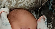 Aralynn is registered to the contest to win money with this photo: baby, blanket, care, child, closeup, cozy, cute, heart_stickers, indoor, infant, nap, newborn, peaceful, person, resting, sleeping, soft_texture, tender, warm, wrapped