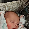 newborn, baby, sleeping, blanket, heart_stickers, cozy, infant, closeup, soft_texture, wrapped, peaceful, person, child, resting, cute, indoor, warm, nap, tender, care