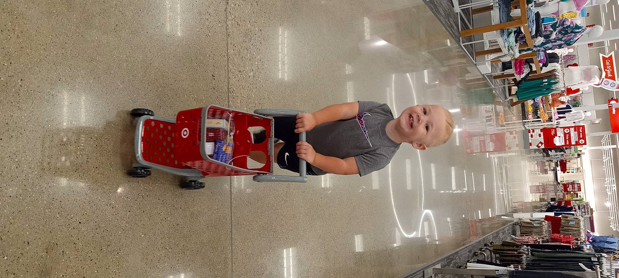 Kaysen is registered to the contest to win money with this photo: advertising, automotive_design, building, hat, human_leg, joy, machine, motor_vehicle, person, retail, room, smile, t_shirt, thigh