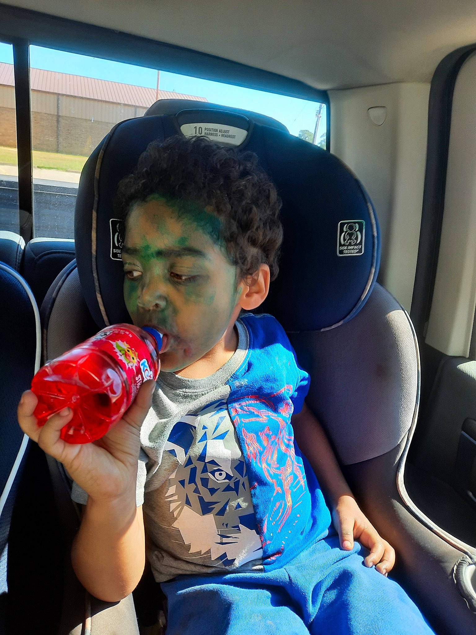Manny joined the competition — help win amazing prizes! air_travel, auto_part, automotive_design, car_seat, carbonated_soft_drinks, child, drink, drinking, drinkware, family_car, fun, head_restraint, motor_vehicle, person, sitting, soft_drink, t_shirt, toddler, travel, vehicle