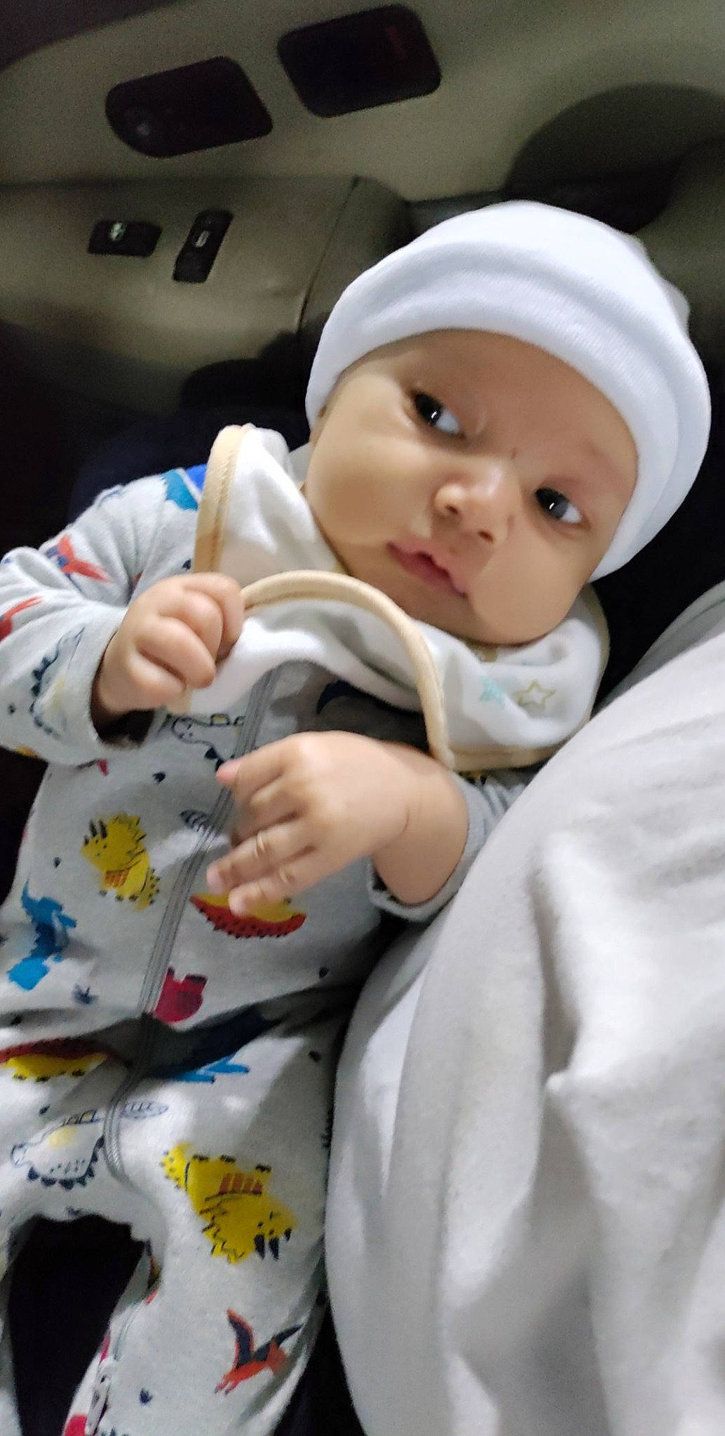 Brandon Jr is registered to the contest to win money with this photo: baby, baby_products, baby_toddler_clothing, cap, car_seat, carmine, cheek, child, comfort, finger, gesture, headwear, linens, nail, person, room, skin, sleeve, thumb, toddler