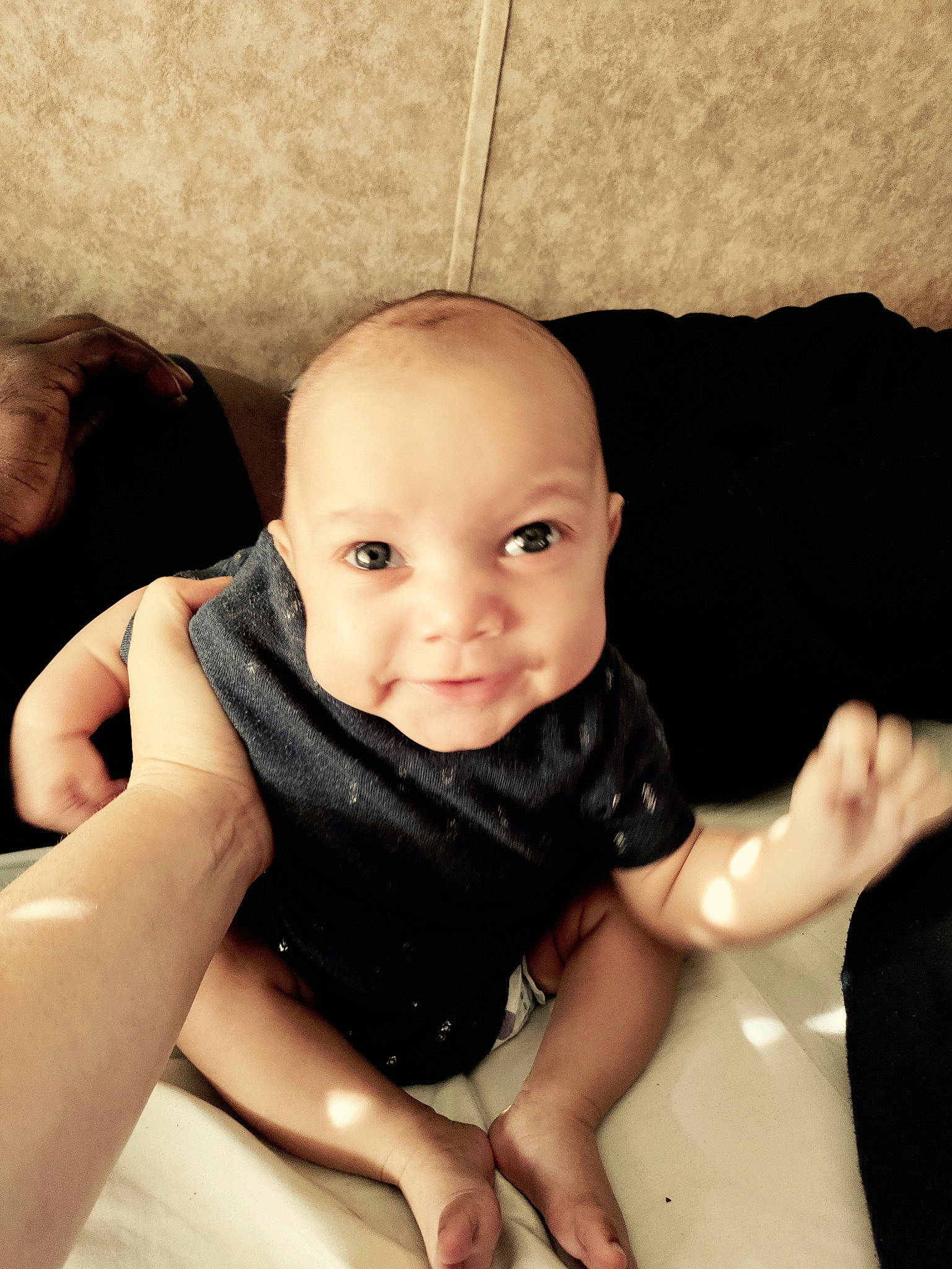 Brandon Jr is registered to the contest to win money with this photo: arm, baby, cheek, comfort, eyebrow, finger, flash_photography, gesture, hand, happy, human_body, iris, joint, lip, mouth, nose, person, skin, sleeve, smile