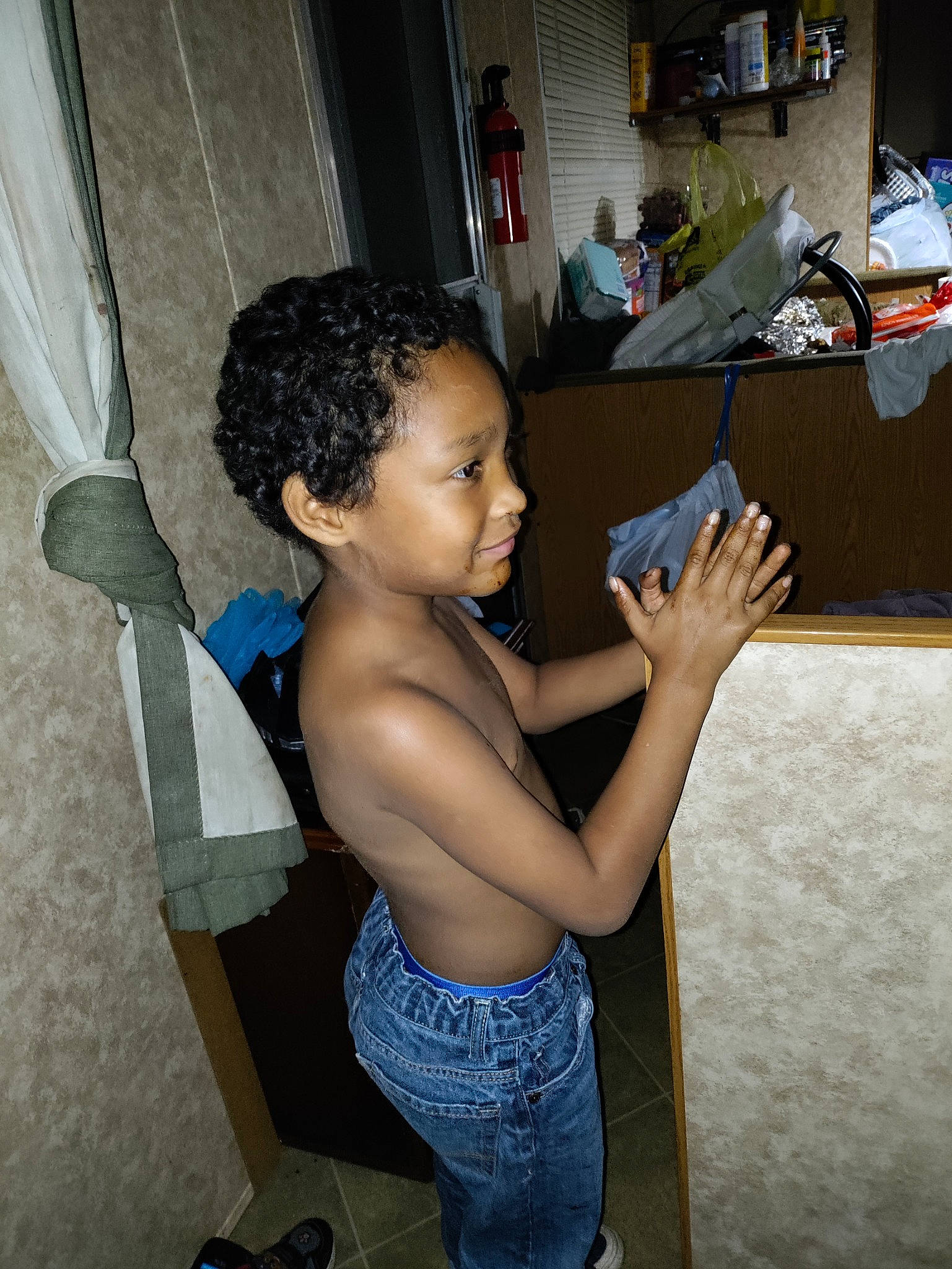 Brandon is registered to the contest to win money with this photo: arm, child, elbow, finger, flooring, fun, gesture, hairstyle, happy, human, human_leg, joint, person, room, shoulder, sitting, standing, thigh, thumb, toddler