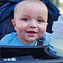 baby, smiling, stroller, blue_blanket, bottle, milk_bottle, outdoor, child, happy, face, person, head, clothing, baby_clothes, infant, seatbelt, graco, nature, daylight, portrait