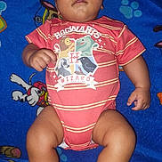 Prince Legend is registered to the contest to win money with this photo: baby, infant, child, blanket, blue_blanket, onesie, clothing, red_striped_onesie, hand, skin, legs, feet, face, lying_down, cartoon_characters, hogwarts, wizard, cute, indoors, relaxed