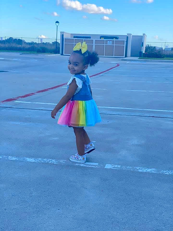 Bailee is registered to the contest to win money with this photo: asphalt, azure, blue, cloud, dress, electric_blue, fun, hat, horizon, joy, magenta, pedestrian, person, pole, recreation, road, road_surface, sky, street, travel