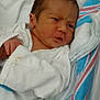 Jose is registered to the contest to win money with this photo: architecture, baby, bed, blanket, building, cradle, crib, cushion, face, furniture, head, homedecor, hospital, infantbed, newborn, person, photography, portrait, quilt, sleeping