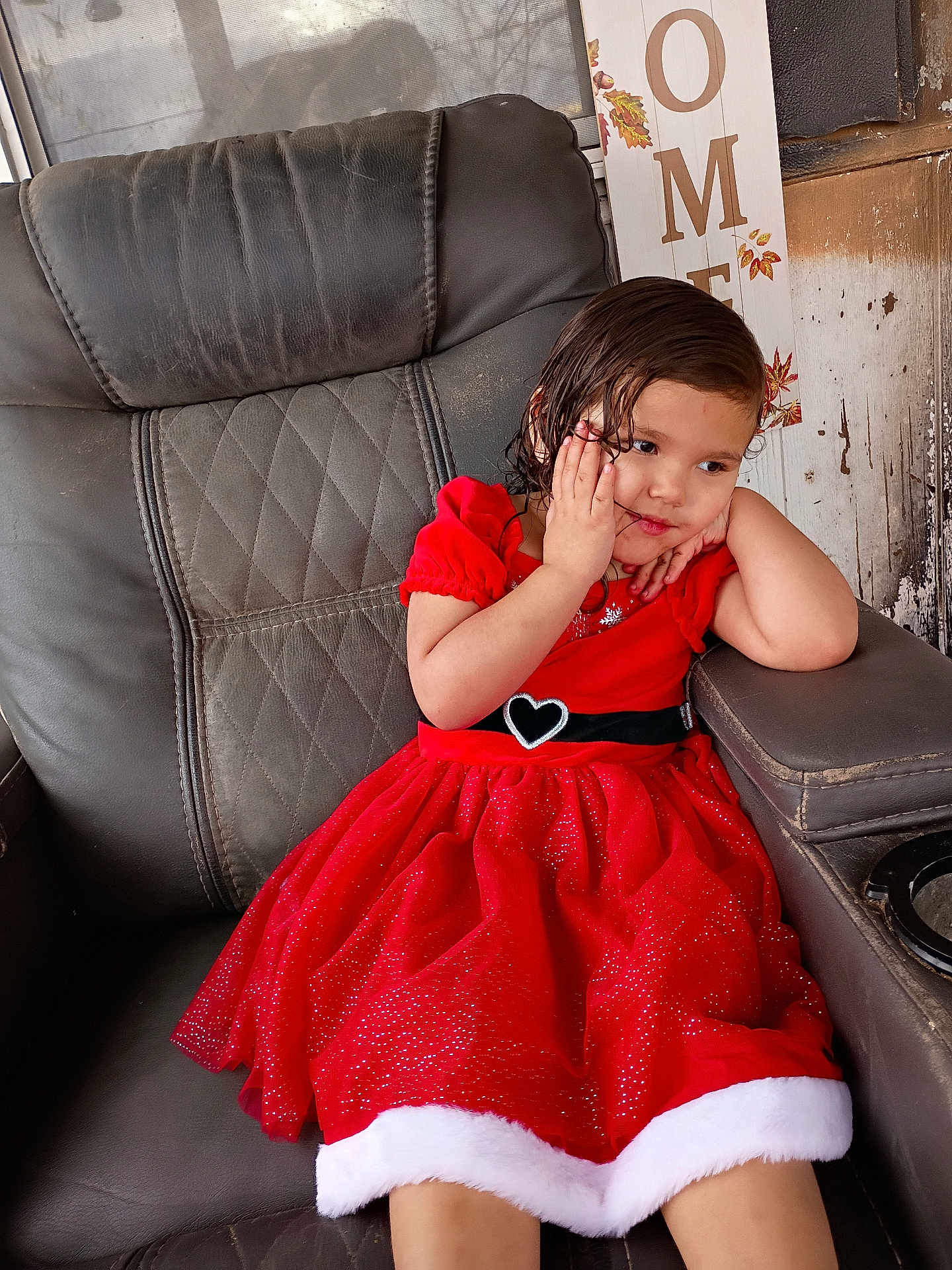 Alaya joined the competition — help win amazing prizes! child, girl, red_dress, heart_belt, leather_chair, sitting, thoughtful, indoors, portrait, brown_hair, cute, young, furniture, window, decor, holiday_dress, fashion, expression, pose, casual