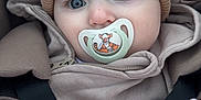 Ace is registered to the contest to win money with this photo: baby, pacifier, hat, blanket, clothing, seat, child, cute, closeup, blue_eyes, knit, animal_print, comfort, infant, warm, portrait, soft, toddler, indoors, cozy