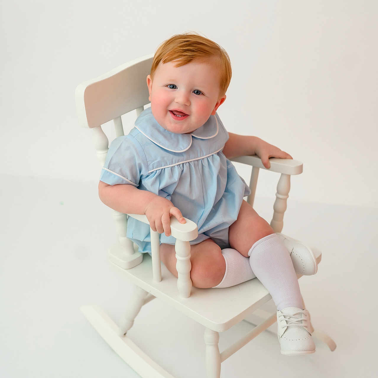 Westyn is registered to the contest to win money with this photo: armchair, baby, bodypart, chair, clothing, crib, face, finger, footwear, furniture, hand, hardwood, head, infantbed, person, photography, portrait, rockingchair, shoe, sitting
