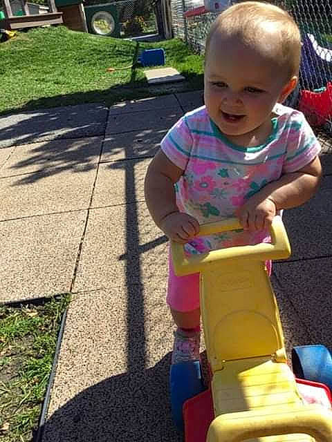 Carlie joined the competition — help win amazing prizes! baby, baby_products, baby_toddler_clothing, child, chute, city, fun, grass, happy, leisure, outdoor_play_equipment, person, play, recreation, riding_toy, sitting, smile, tire, toddler, vacation