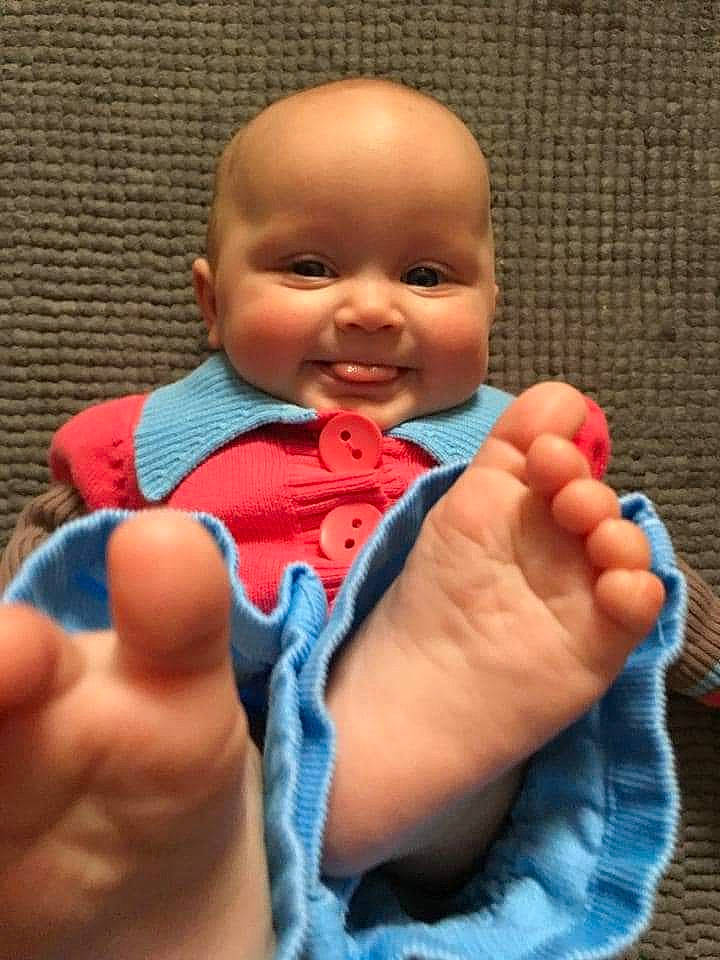 Carlie joined the competition — help win amazing prizes! baby, baby_toddler_clothing, cheek, close_up, electric_blue, eye, finger, gesture, hand, happy, joy, lip, mouth, nail, nose, person, skin, sleeve, smile, thumb