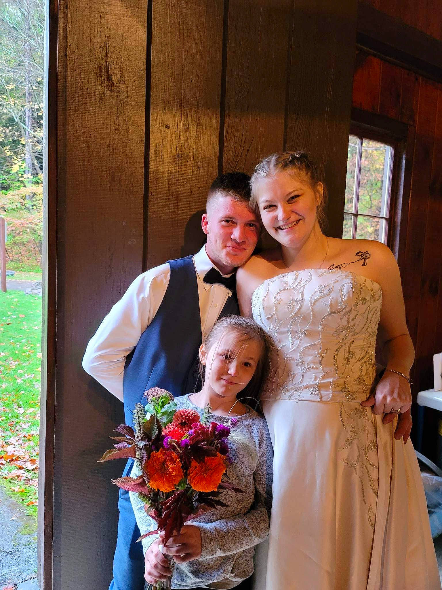 Jaxon is registered to the contest to win money with this photo: bouquet, bridal_accessory, bridal_clothing, bridal_party_dress, bride, clothing, dress, event, flower, flower_arranging, formal_wear, fun, gown, happy, joy, marriage, orange, person, plant, smile