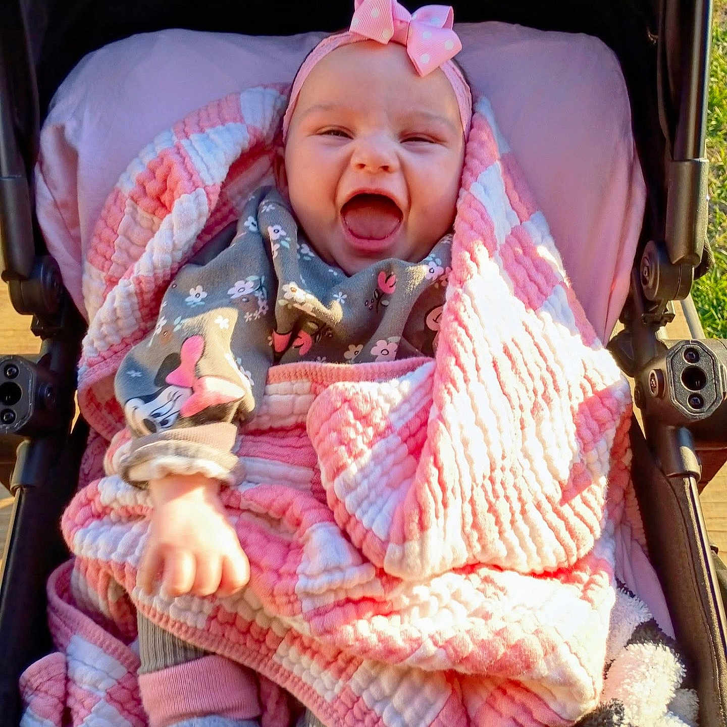 Gracie joined the competition — help win amazing prizes! baby, child, stroller, blanket, pink, quilt, headband, bow, smiling, happy, outdoor, clothing, cute, infant, person, portrait, sunlight, warm, cozy, laughing