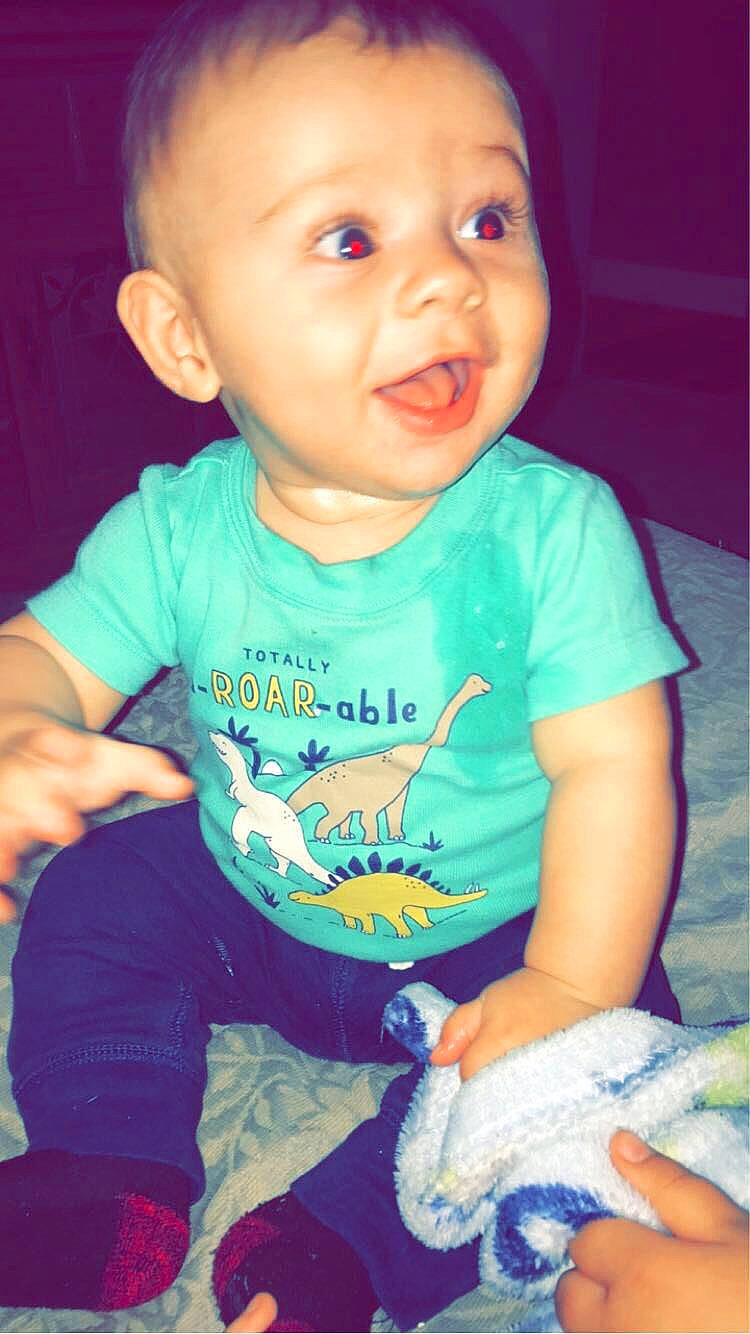 Tobias is registered to the contest to win money with this photo: arm, azure, baby_toddler_clothing, cheek, chin, eye, face, facial_expression, hair, hairstyle, hand, head, human, lip, mouth, nose, organ, person, product, skin