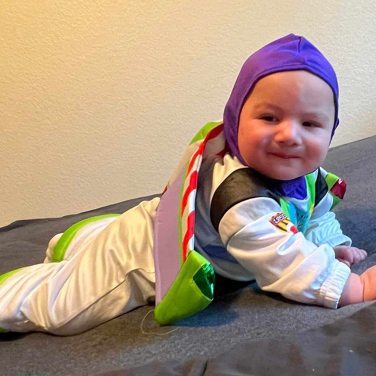 Dustin joined the competition — help win amazing prizes! baby, babycrawling, babylaughing, bonnet, clothing, coat, costume, crawling, cushion, face, happy, hat, head, jacket, newborn, pants, person, photography, portrait, sitting