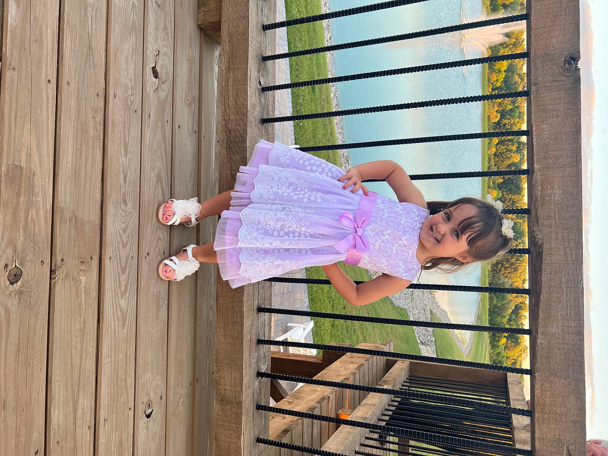 Alivia is registered to the contest to win money with this photo: child, fun, happy, house, human_leg, joy, leisure, magenta, pattern, person, pink, sandal, sitting, t_shirt, textile, thigh, tints_and_shades, tree, vacation, waist