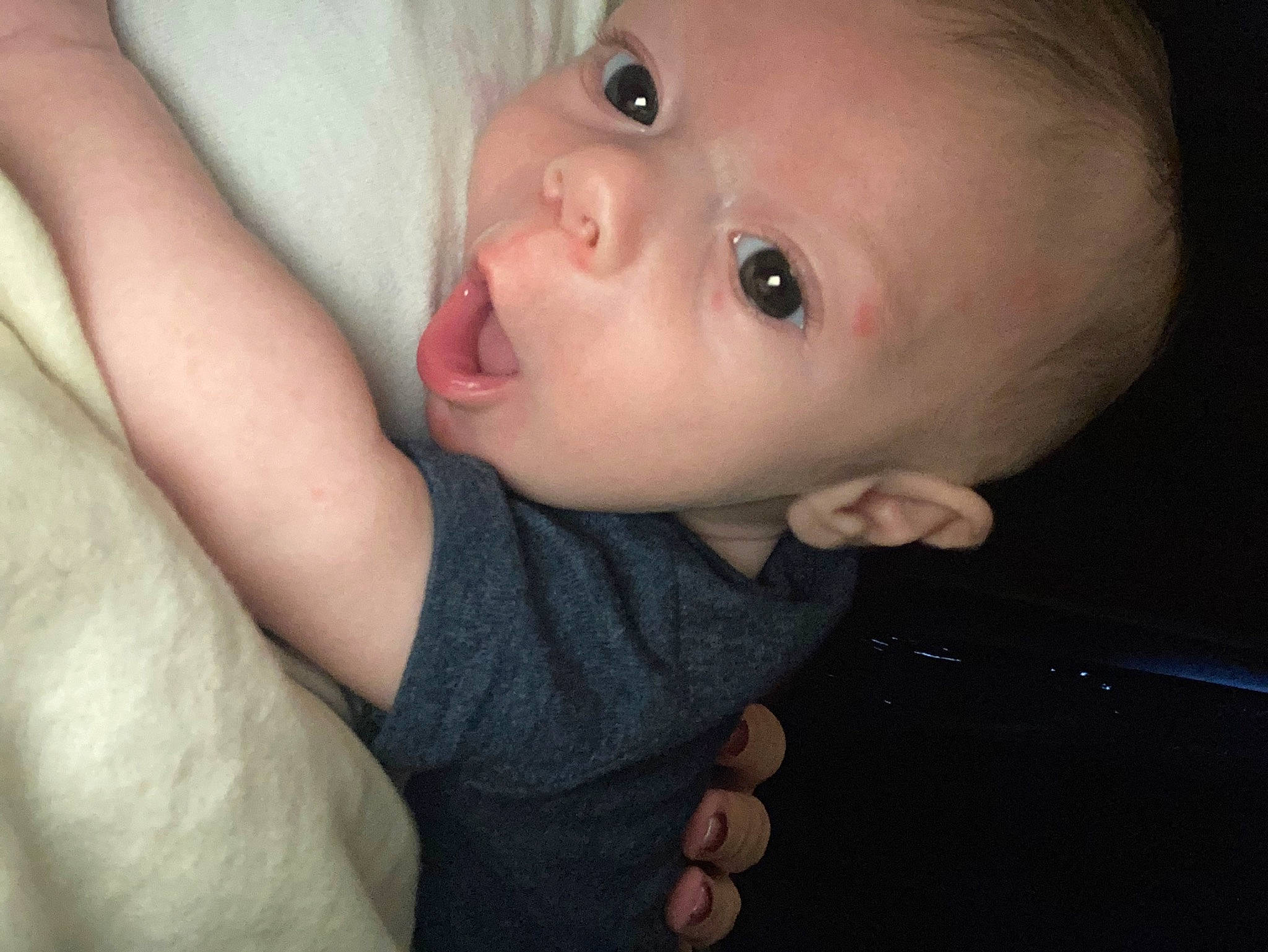 Kodi is registered to the contest to win money with this photo: arm, baby, baby_toddler_clothing, cheek, chest, ear, eyelash, finger, flash_photography, gesture, hand, happy, iris, lip, mouth, nail, nose, person, skin, thumb