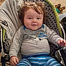 Jaxson is registered to the contest to win money with this photo: baby, child, infant, portrait, smiling, happy, sitting, bouncer, baby_chair, shark, pajamas, striped_clothing, blanket, stuffed_toy, toy, carpet, indoor, home, face, brown_hair