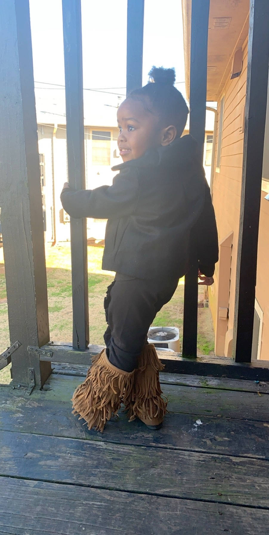 Raegan is registered to the contest to win money with this photo: black_hair, denim, eyewear, flooring, fun, fur, grass, human_leg, knee, long_hair, person, personal_protective_equipment, sitting, sportswear, standing, street_fashion, t_shirt, thigh, waist, window