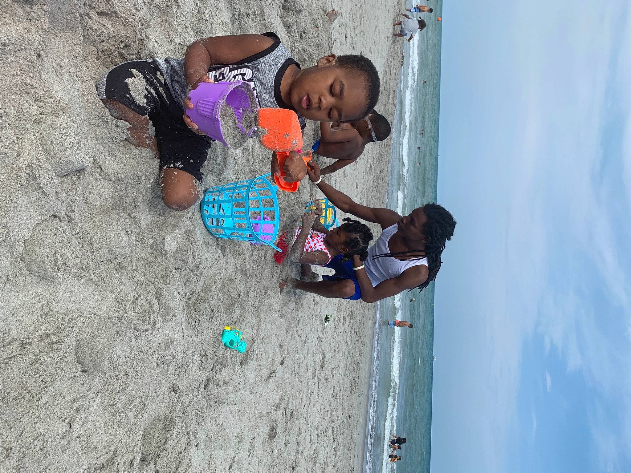 Kyree is registered to the contest to win money with this photo: azure, beach, child, cloud, concrete, fun, happy, leisure, person, play, recreation, sand, sky, soil, t_shirt, toddler, travel, vacation, water