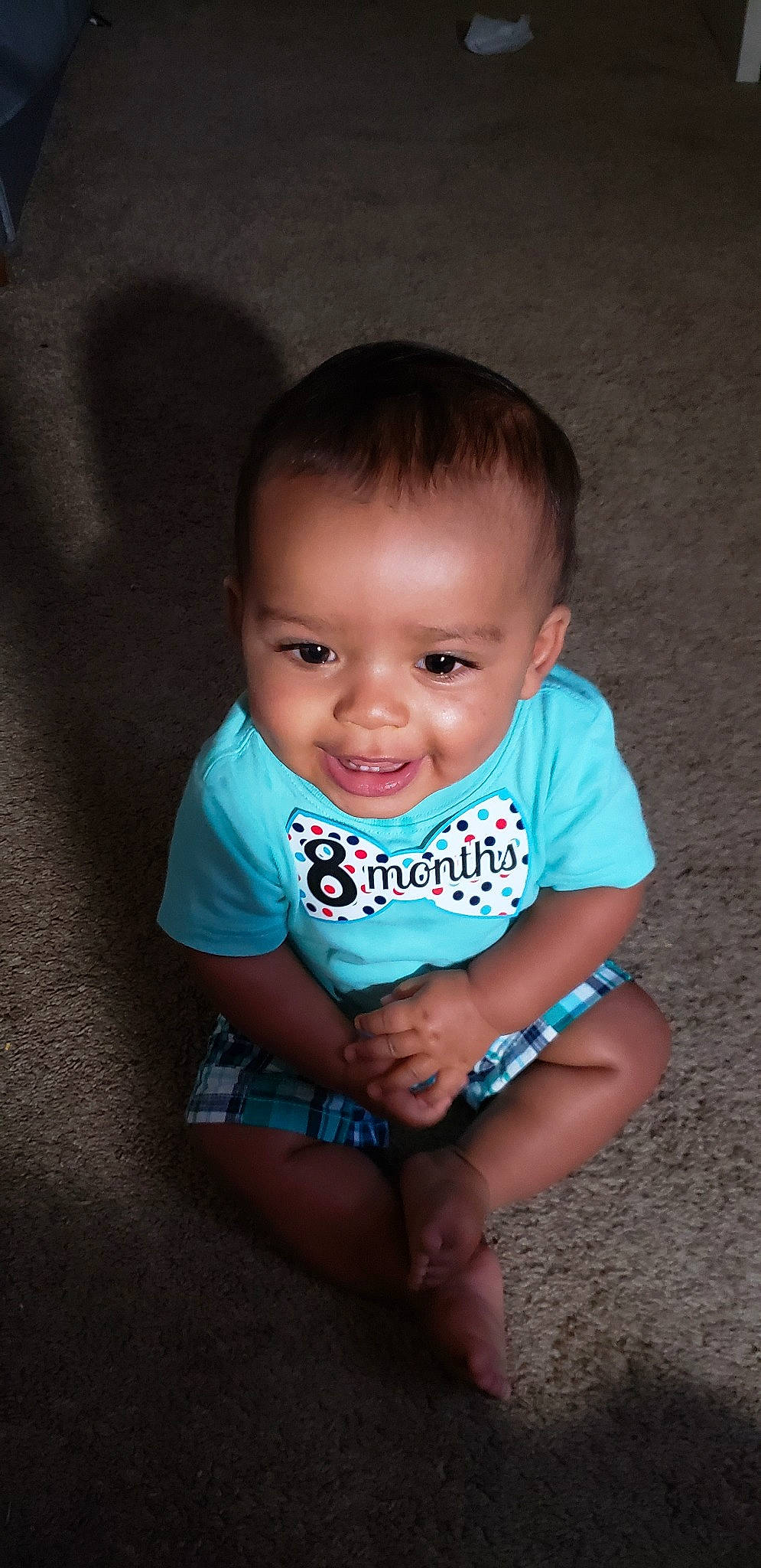 Jasiah is registered to the contest to win money with this photo: baby, baby_toddler_clothing, cheek, child, chin, joy, person, sitting, skin, smile, toddler, turquoise