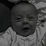 Elyo a rejoint le concours — aidez-le/la à gagner de superbes lots ! baby, bedding, blanket, cheeks, close_up, clothing, eyes, face, hair, hand, indoor, infant, monochrome, mouth, newborn, onesie, portrait, smile, soft_light, star_pin
