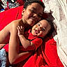 Seth joined the competition — help win amazing prizes! child, baby, smile, hug, red_blanket, bedroom, indoor, happy, cuddling, sibling, person, clothing, furniture, blanket, toddler, infant, face, hair, skin, cozy