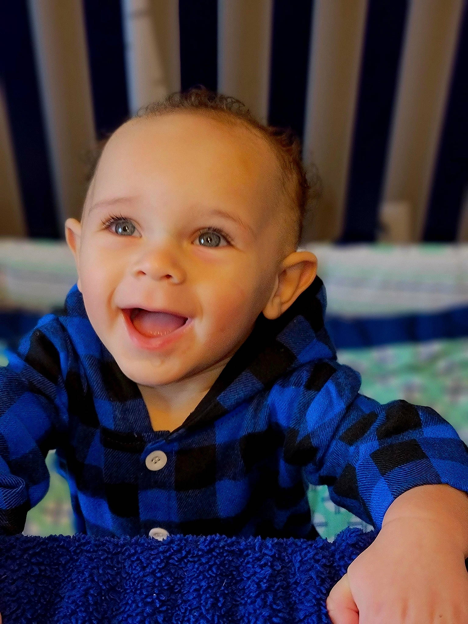 Kreed is registered to the contest to win money with this photo: baby, baby_toddler_clothing, cheek, child, chin, electric_blue, eye, finger, flooring, happy, head, iris, nose, pattern, person, sitting, skin, sleeve, smile, t_shirt