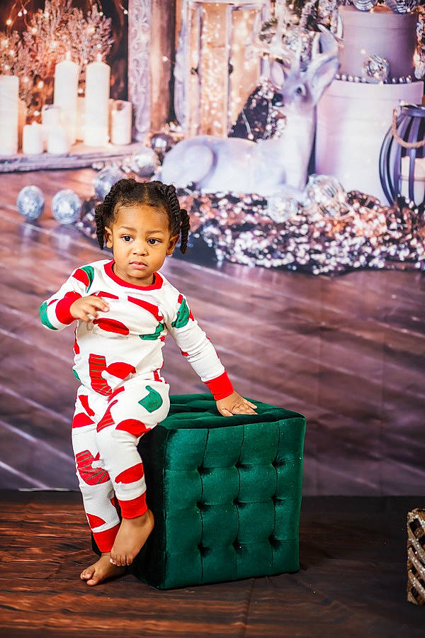 Jamari is registered to the contest to win money with this photo: baby, baby_toddler_clothing, child, christmas, clothing, door, event, flooring, fun, happy, holiday, leisure, magenta, person, sitting, sleeve, smile, toddler, tradition, travel
