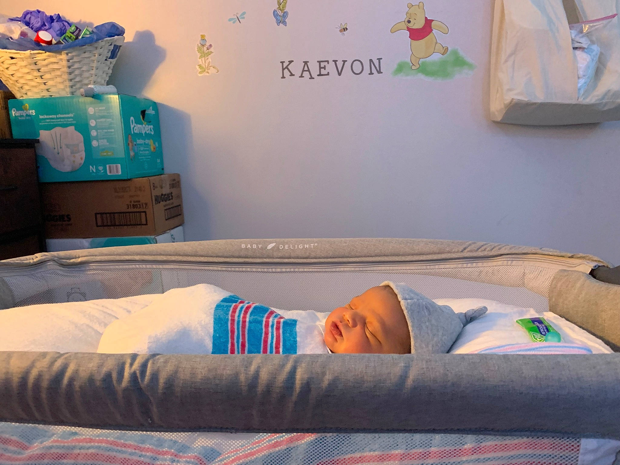 Kaevon is registered to the contest to win money with this photo: baby, baby_sleeping, bedding, blue, carton, child, comfort, green, infant_bed, leisure, linens, packaging_and_labeling, person, product, rectangle, room, shipping_box, throw_pillow, toddler, white